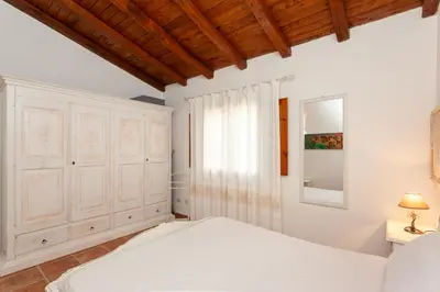 Letto o letti in una camera di Villetta Costa Caddu