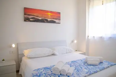 Letto o letti in una camera di Davanti alla spiaggia - Salina Bamba Home