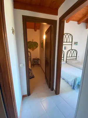 Letto o letti in una camera di Villetta Capo Coda Cavallo
