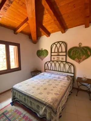 Letto o letti in una camera di Villetta Capo Coda Cavallo