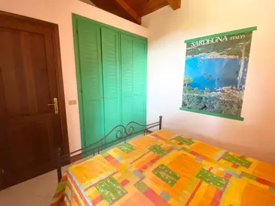 Letto o letti in una camera di Villetta Capo Coda Cavallo 2