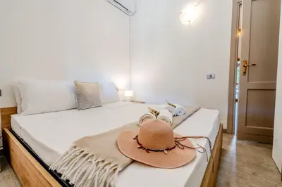 Letto o letti in una camera di 5min dalla Spiaggia La Cinta - Villetta Elegante a San Teodoro