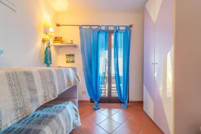 Letto o letti in una camera di Villetta Bianchi - By Searly