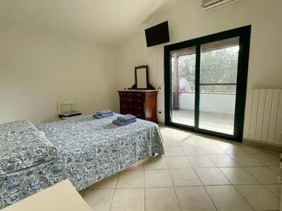 Letto o letti in una camera di Casa Smeraldo