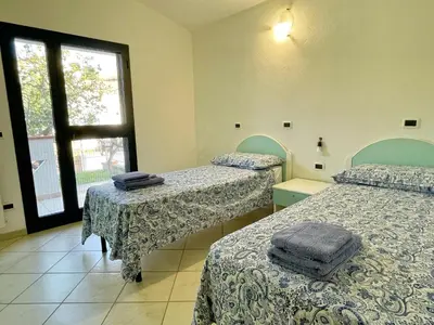 Letto o letti in una camera di Casa Smeraldo