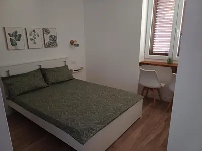 Letto o letti in una camera di Domo Ulleri