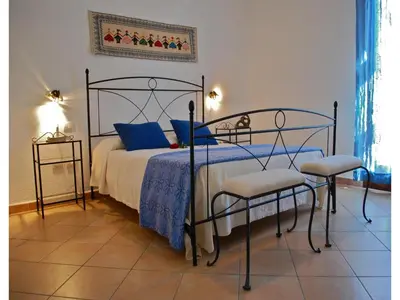 Letto o letti in una camera di Appartements in San Teodoro