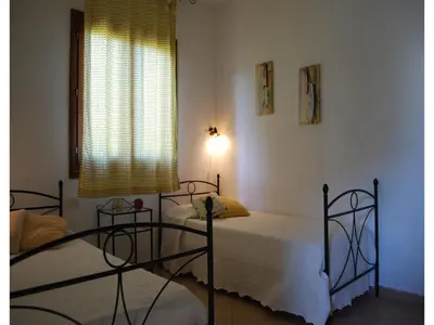 Letto o letti in una camera di Appartements in San Teodoro