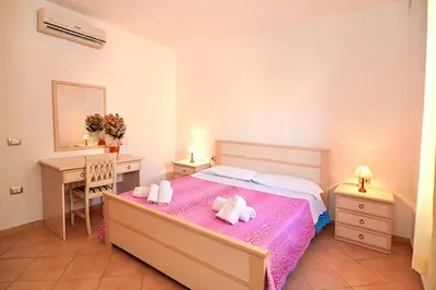Letto o letti in una camera di Residence with swimming pool just 5 minutes from Budoni, apartments with air conditoning and private outdoor area