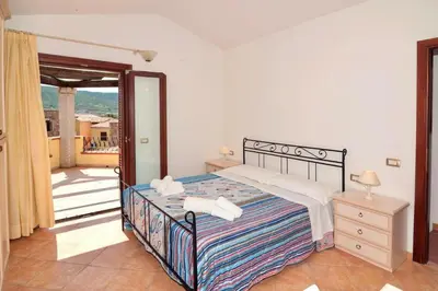 Letto o letti in una camera di ISA-Residence with swimming pool near Budoni