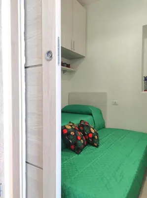 Letto o letti in una camera di Casa Soliana ampio appartamento per 6 Fiber & WiFi