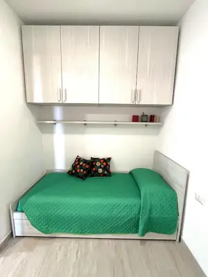 Letto o letti in una camera di Casa Soliana ampio appartamento per 6 Fiber & WiFi