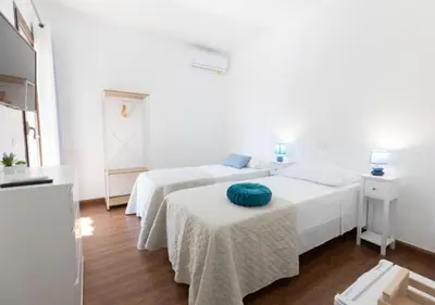 Letto o letti in una camera di La Magnolia Rooms