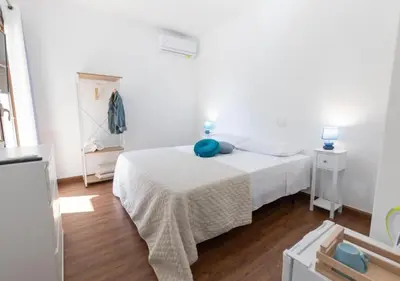 Letto o letti in una camera di La Magnolia Rooms