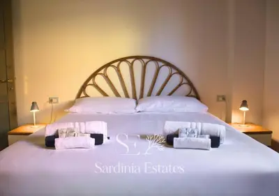 Letto o letti in una camera di San Teodoro Centro - Villetta con giardino