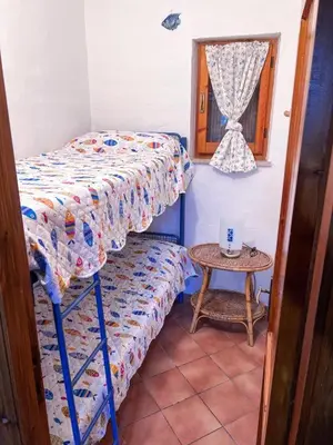 Letto o letti in una camera di Rifugio Tavolara