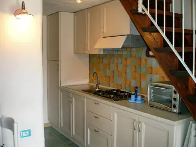 Cucina o angolo cottura di La Casa di Rina Villaggio Tamerici