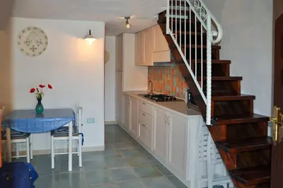 Cucina o angolo cottura di La Casa di Rina Villaggio Tamerici