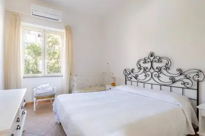 Letto o letti in una camera di Casa Colombo