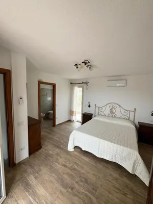 Letto o letti in una camera di Budoni residence Lutturai 2