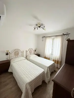 Letto o letti in una camera di Budoni residence Lutturai 4