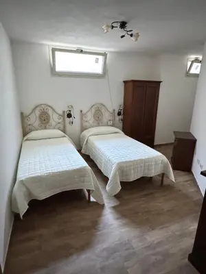 Letto o letti in una camera di Budoni residence Lutturai 4