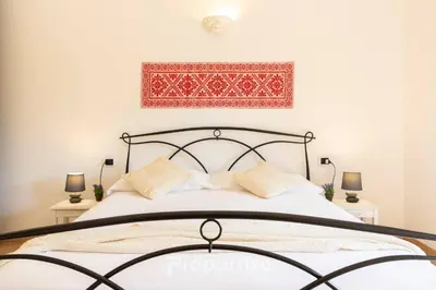 Letto o letti in una camera di Villetta con idromassaggio e patio by Propertize