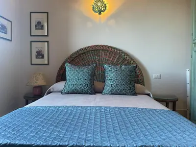 Letto o letti in una camera di Villetta Vista Mare San Teodoro Coda Cavallo