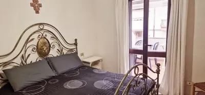 Letto o letti in una camera di Casa C&C duplex centro Olbia