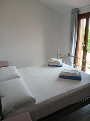 Letto o letti in una camera di Ottiolu House villa 50m from beach