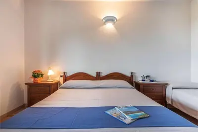 Letto o letti in una camera di Casa Pompia 6