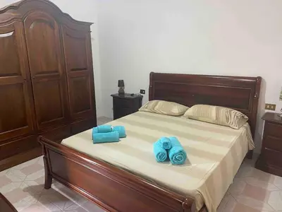 Letto o letti in una camera di Appartamento a pochi passi dal mare