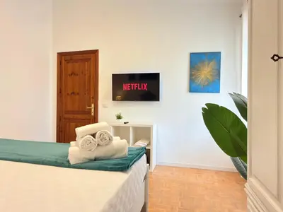 Letto o letti in una camera di La Valentia - Appartamento con spazio esterno a pochi minuti di auto dalla spiaggia di Marina di Orosei
