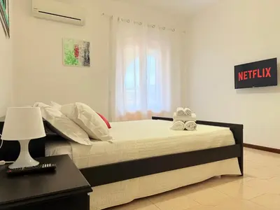 Letto o letti in una camera di Le Solero - Appartamento in posizione strategica a Orosei