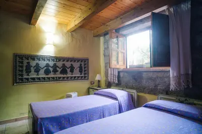 Letto o letti in una camera di B&B San Michele
