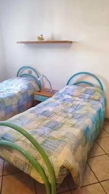 Letto o letti in una camera di Casa Antonella