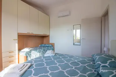 Letto o letti in una camera di GuestHost - Casa Nina - relax close to the beach
