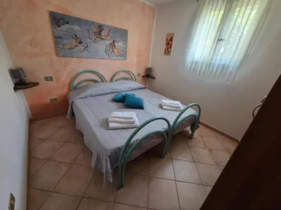 Letto o letti in una camera di Casa Lara San Teodoro
