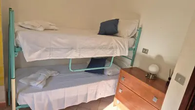 Letto o letti in una camera di Casa Lara San Teodoro