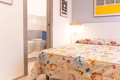 Letto o letti in una camera di Casa Jo del Mare, a pochi passi dalla spiaggia