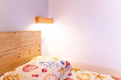 Letto o letti in una camera di Casa Jo del Mare, a pochi passi dalla spiaggia