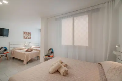 Letto o letti in una camera di Domo de Centro, centro di Olbia