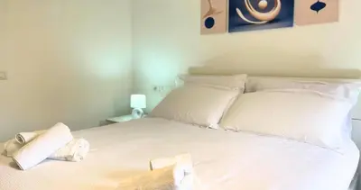 Letto o letti in una camera di Vela House & Garden City Center