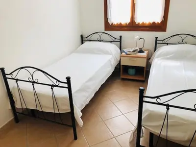 Letto o letti in una camera di Trilocale delle Bouganville