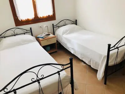 Letto o letti in una camera di Trilocale delle Bouganville