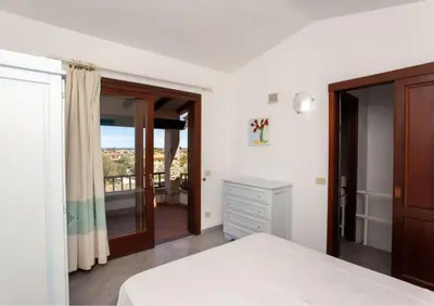 Letto o letti in una camera di HH San Teodoro vista Mare