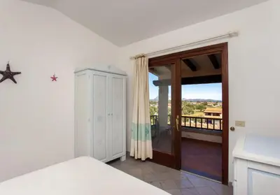 Letto o letti in una camera di HH San Teodoro vista Mare