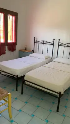 Letto o letti in una camera di Vista mare montagna da Marcello