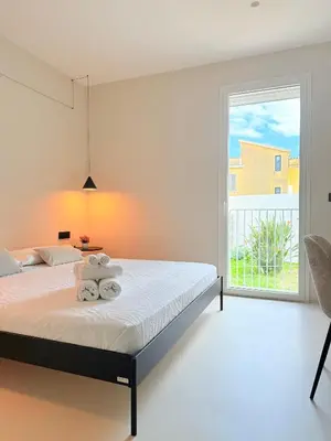Letto o letti in una camera di I Nidi di Dommos - Camere nel centro storico di Orosei