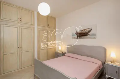Letto o letti in una camera di Quadri Lu Mulinu